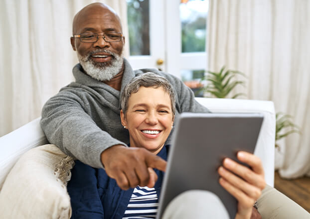 couple looking at a computer tablet together